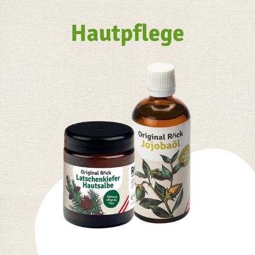 Foto auf der Seite Murmeltier Salbe kaufen - Text Hautpflege und zu sehen ist eine Flasche Jojoba Öl und ein Tiegel Latschenkiefer Creme im Tiegel